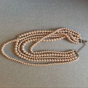 Multi strand faux pearl necklace.